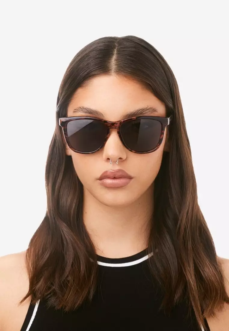 HAWKERS Dark One Sunglasses for Men and Women. UV400 Protection. Official Product Designed in Spain