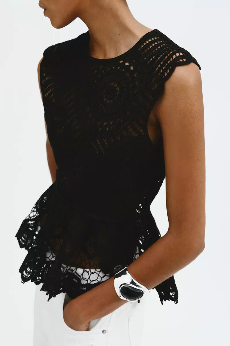 Crochet-look peplum top