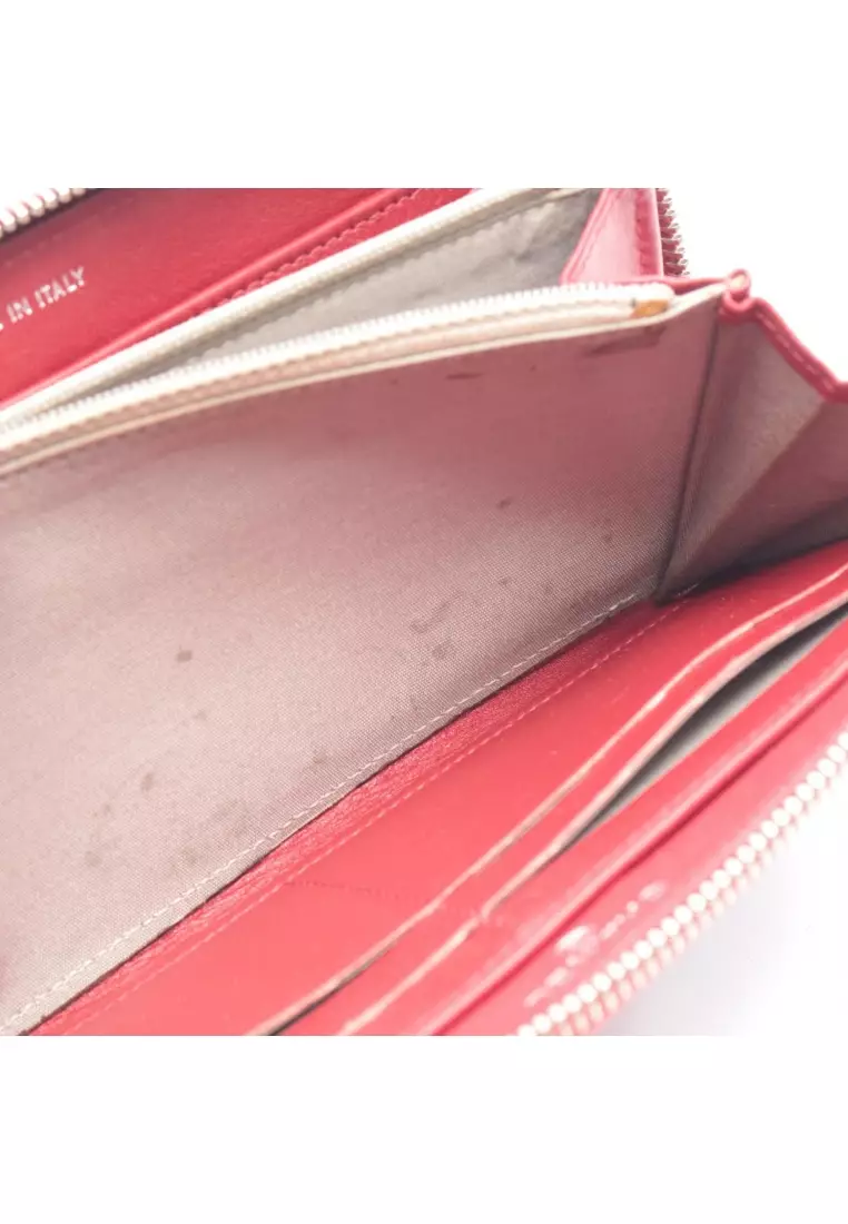 Pre-Loved Chanel round zipper long wallet Caviar skin Red silver hardware