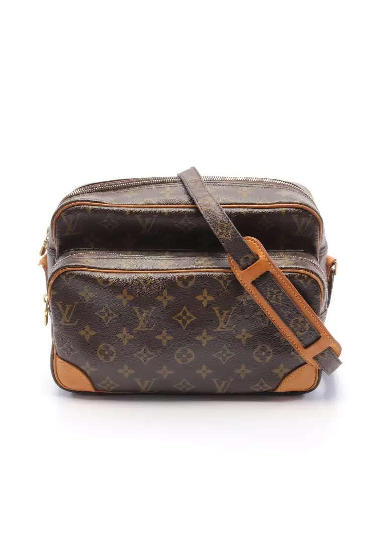 WHAT GOES AROUND COMES AROUND Louis Vuitton Monogram Nile Bag - Brown