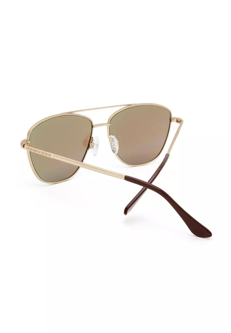 HAWKERS Gold Clear Blue LAX Sunglasses for Men and Women. UV400 Protection. Official Product Designed in Spain