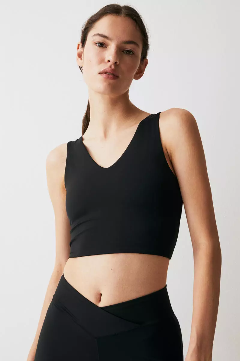 Buy H&M SoftMove™ Medium Support Sports bra in Black Dark 2024 Online