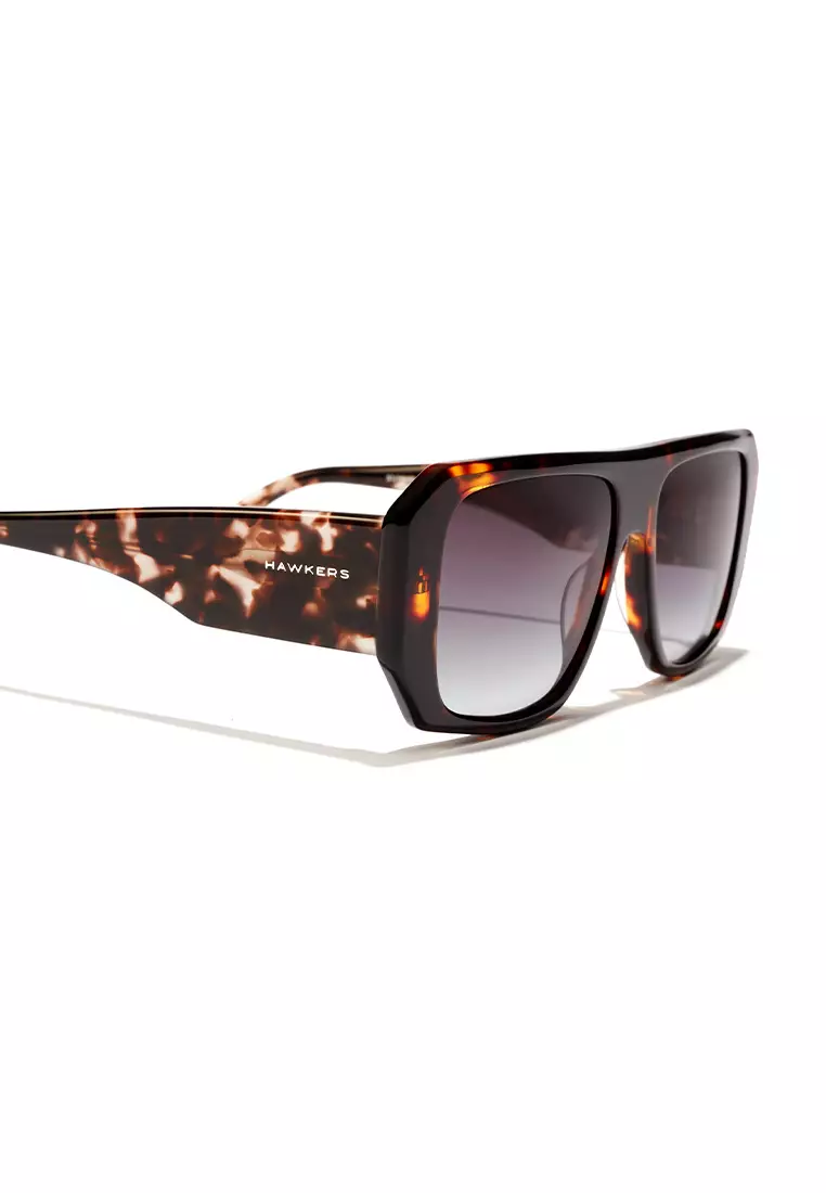 HAWKERS Brown Carey Iron Hell Sunglasses For Men And Women, Unisex. Official Product Designed In Spain