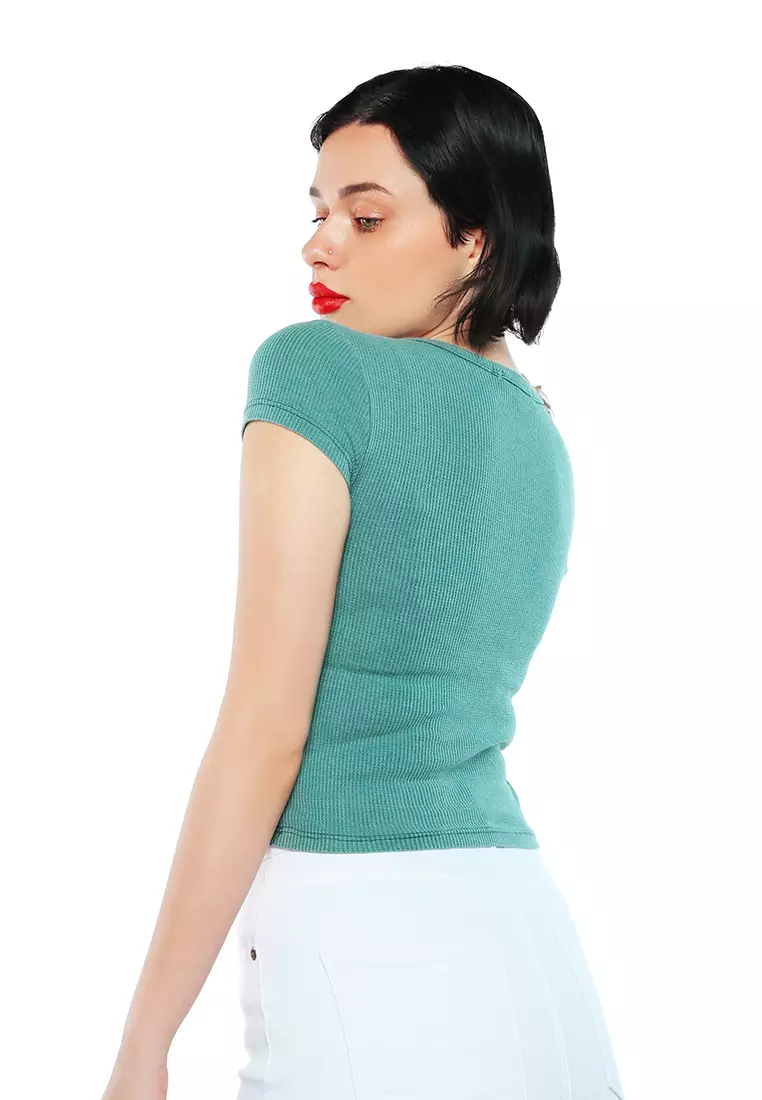 Kancing Hijau Tua Atas Rajutan