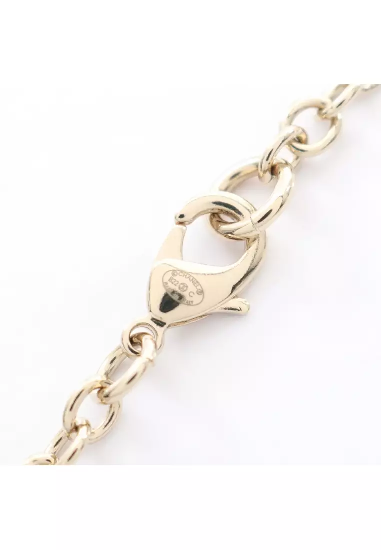 Pre-Loved Chanel coco mark book motif necklace GP gold black B22C