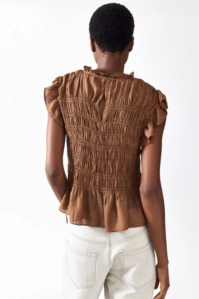 Smocked peplum top