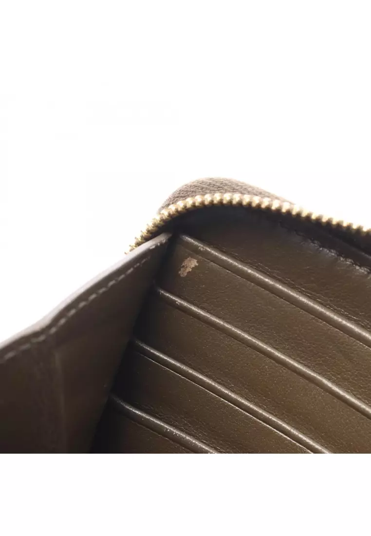 Pre-Loved Celine C-charm large zipped wallet round zipper long wallet quilting leather Khaki brown