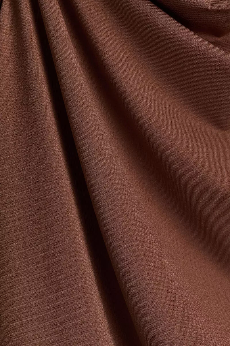 Draped asymmetric top
