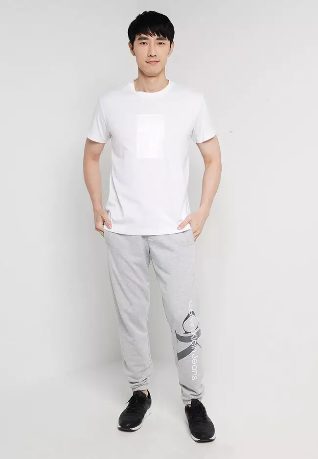 Calvin klein jeans on sale joggers with logo stripe