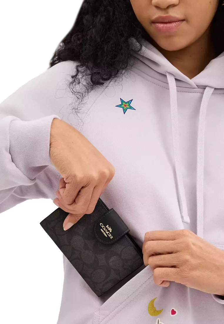 Buy COACH Medium Corner Zip Wallet In Signature Canvas in Walnut