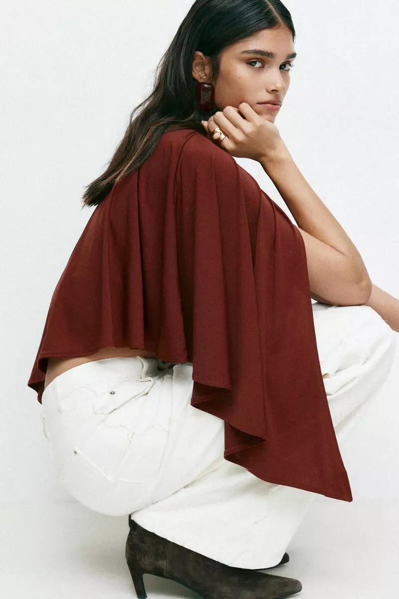 Asymmetric cape top