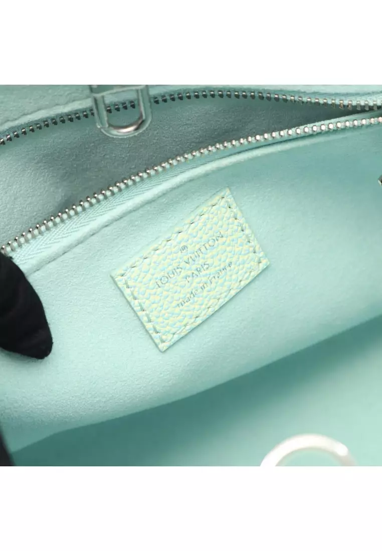 Pre-Loved Louis Vuitton On-the-Go PM Monogram Empreinte Handbag leather Light blue Light yellow 2WAY