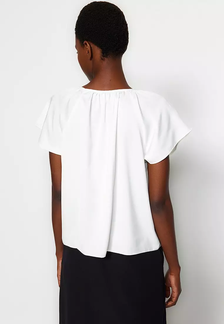 white flared sleeve blouse