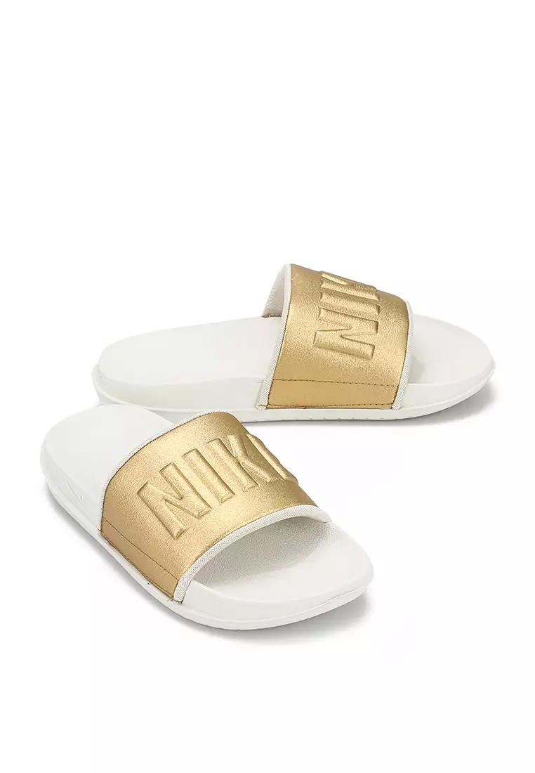 Nike slippers with top gold logo