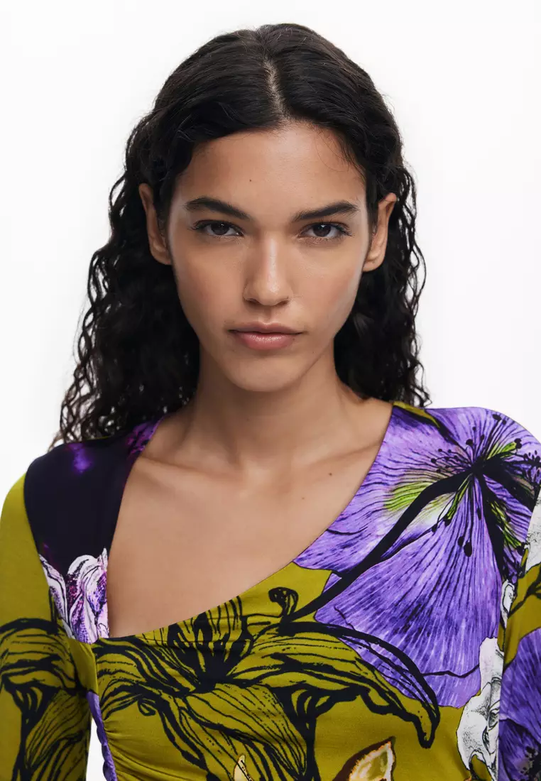 Asymmetric neckline dress designed by Mr. Christian Lacroix