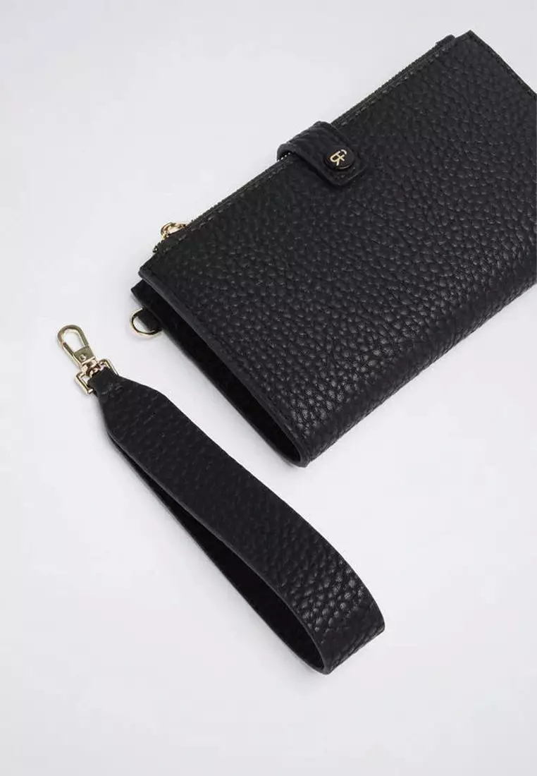 Wallet with hand strap outlet