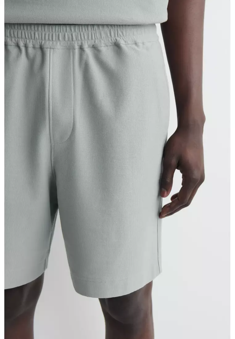 ELASTICATED COTTON-PIQUÉ SHORTS