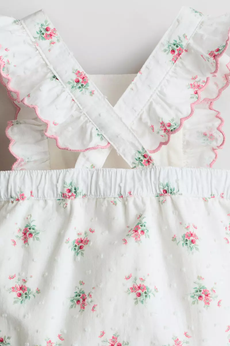 Frill-trimmed cotton romper suit