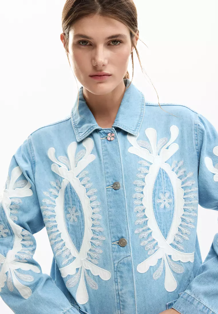 Reversible jacket with embroidery