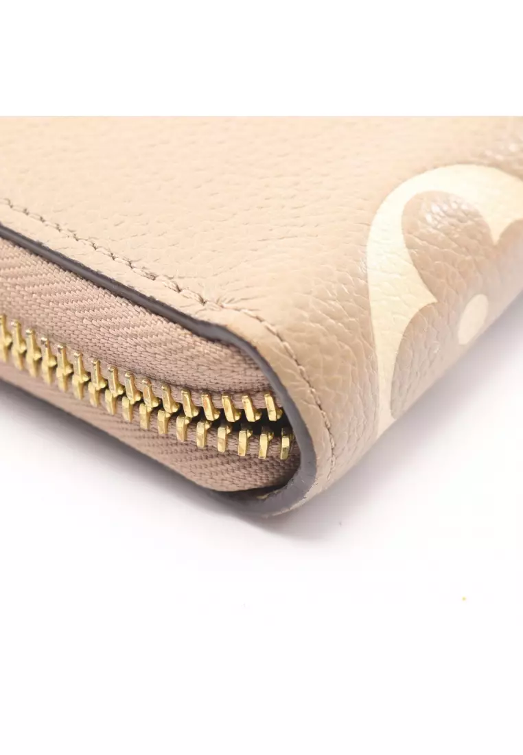 Pre-Loved Louis Vuitton zippy wallet bicolor monogram Empreinte tourterelle claim round zipper long wallet leather Gray beige ivory