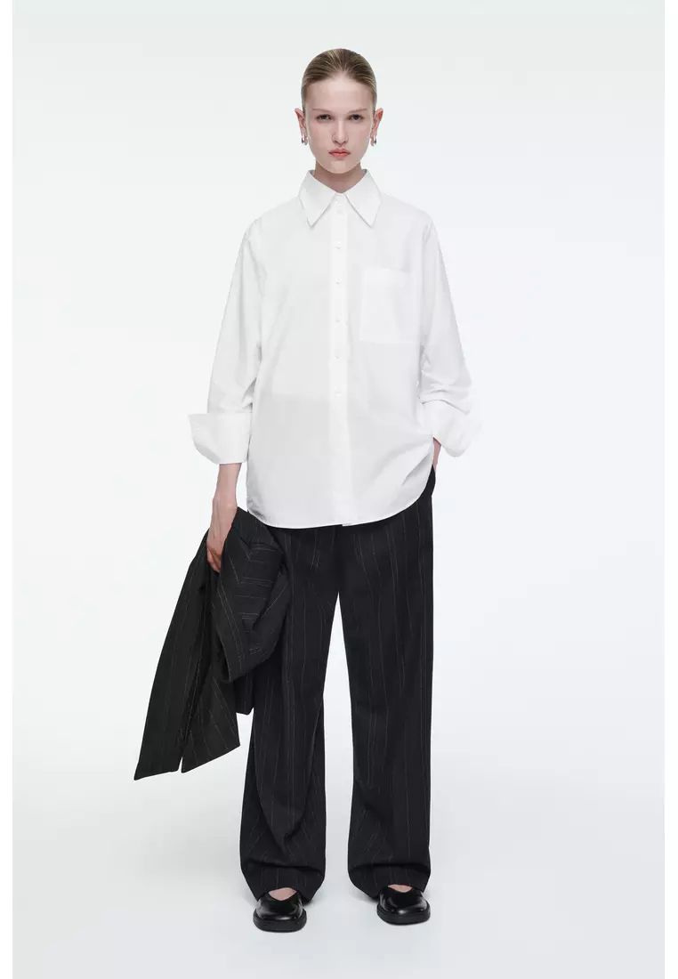 RELAXED PINSTRIPED BARREL-LEG TROUSERS
