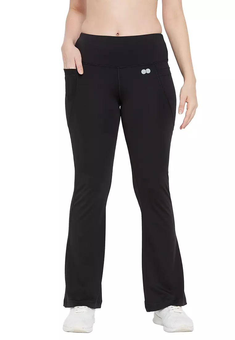Clovia High Waist Flared Yoga Pants in Black with Side Pockets
