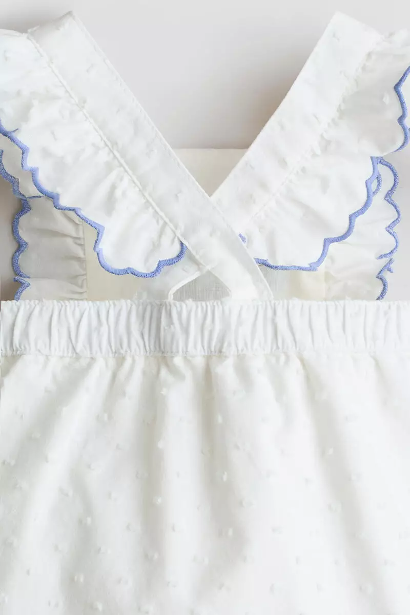 Frill-trimmed cotton romper suit