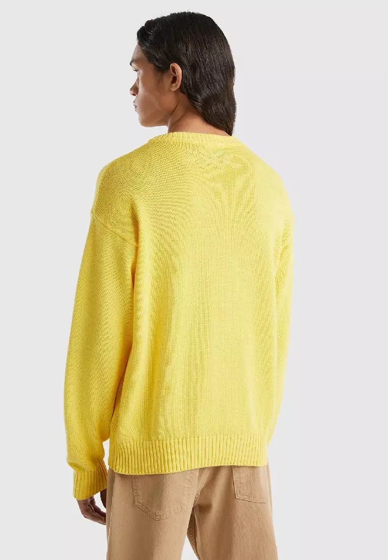 Yellow sweater with apple inlay