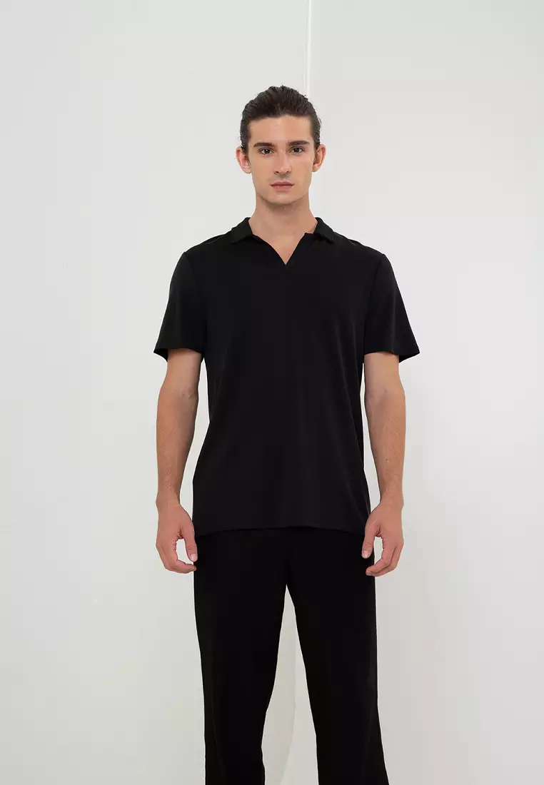 Polo shirt with black top slacks