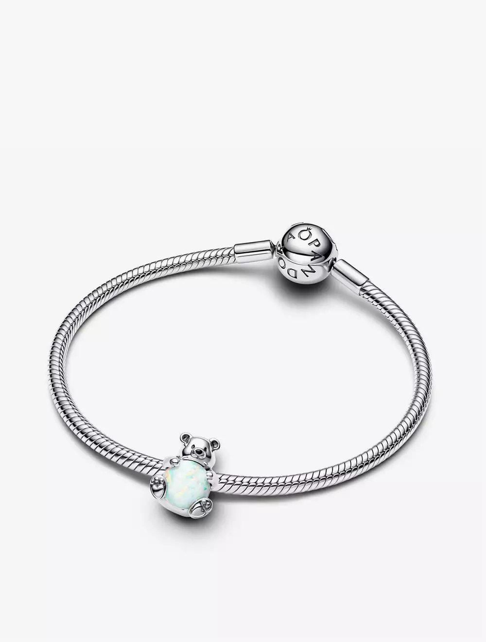 Polar bear sterling silver charm with white lab-created opal and black enamel