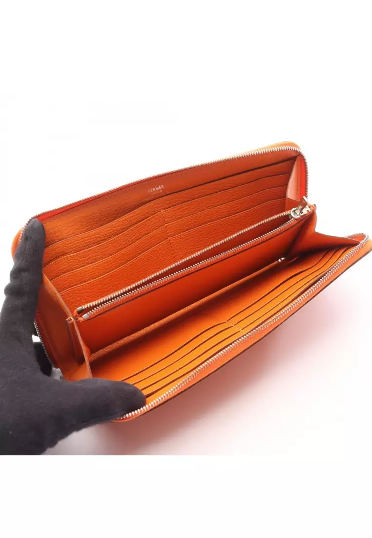 Pre-Loved Hermès Azap Long silk in Feu round zipper long wallet Chevre orange silver hardware □P stamp
