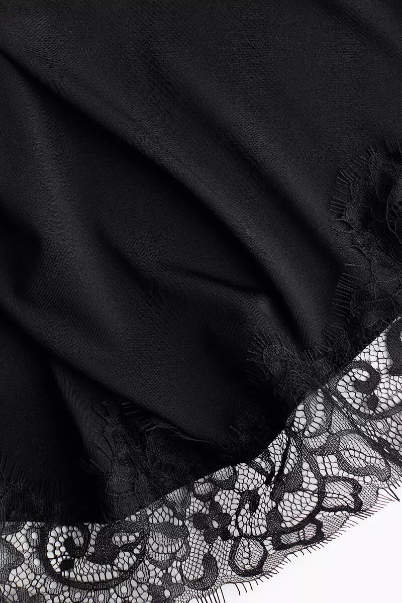 Asymmetric lace-trimmed skirt