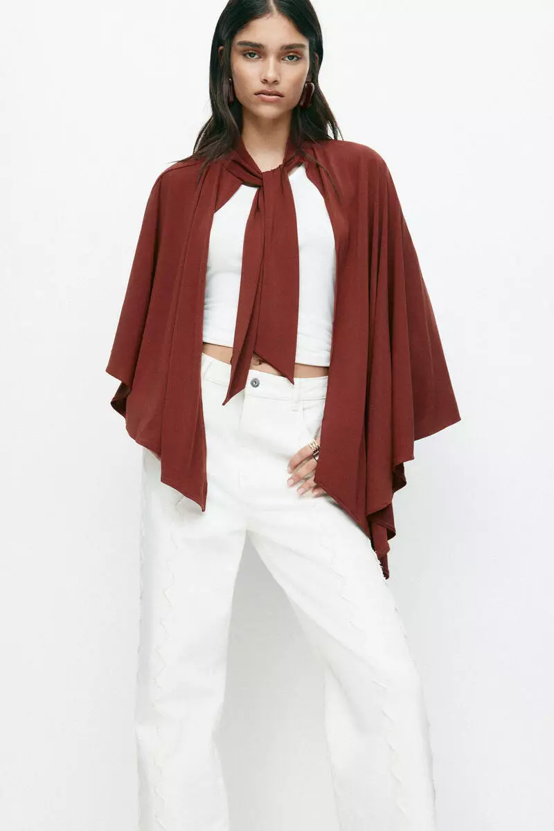 Asymmetric cape top