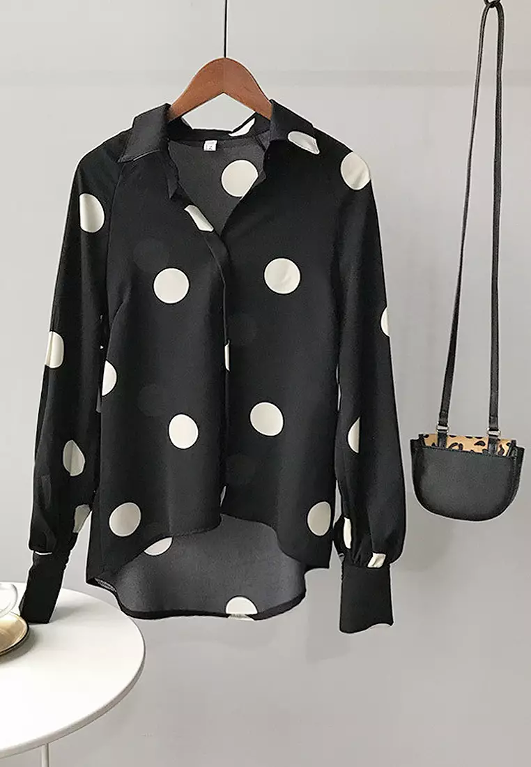 With polka dot shirt and beige shoes