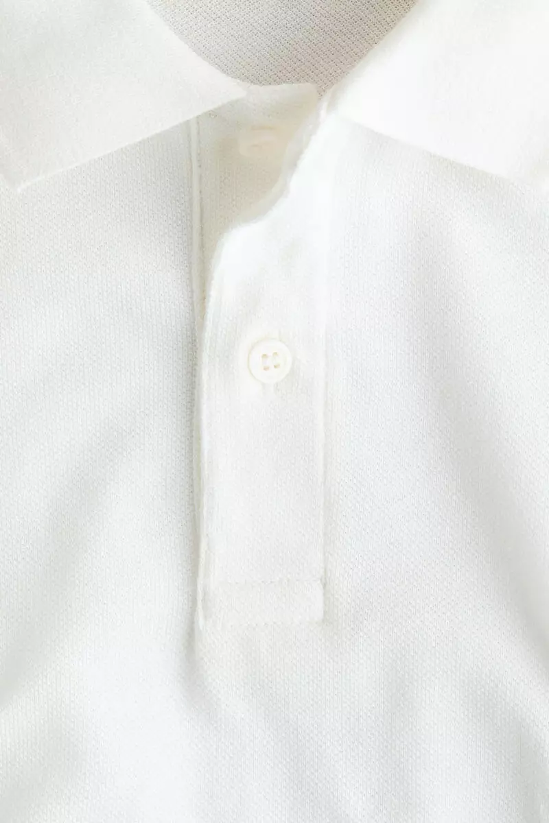 Embroidered-motif piqué polo shirt