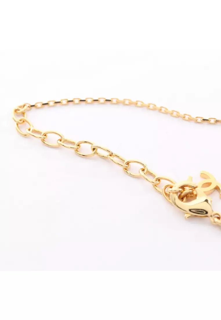 Pre-Loved Chanel coco mark horse riding necklace GP gold white black L26P