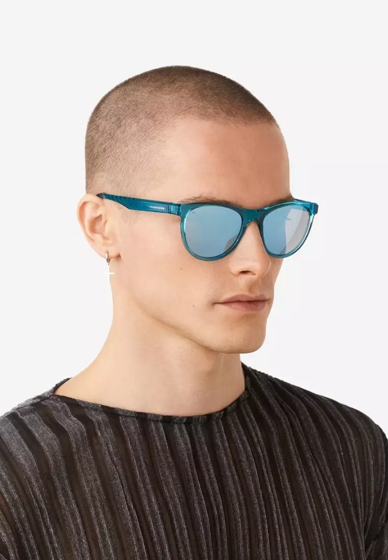 HAWKERS - Polarized Trail Sunglasses For Men And Women, Unisex. Official Product Designed In Spain