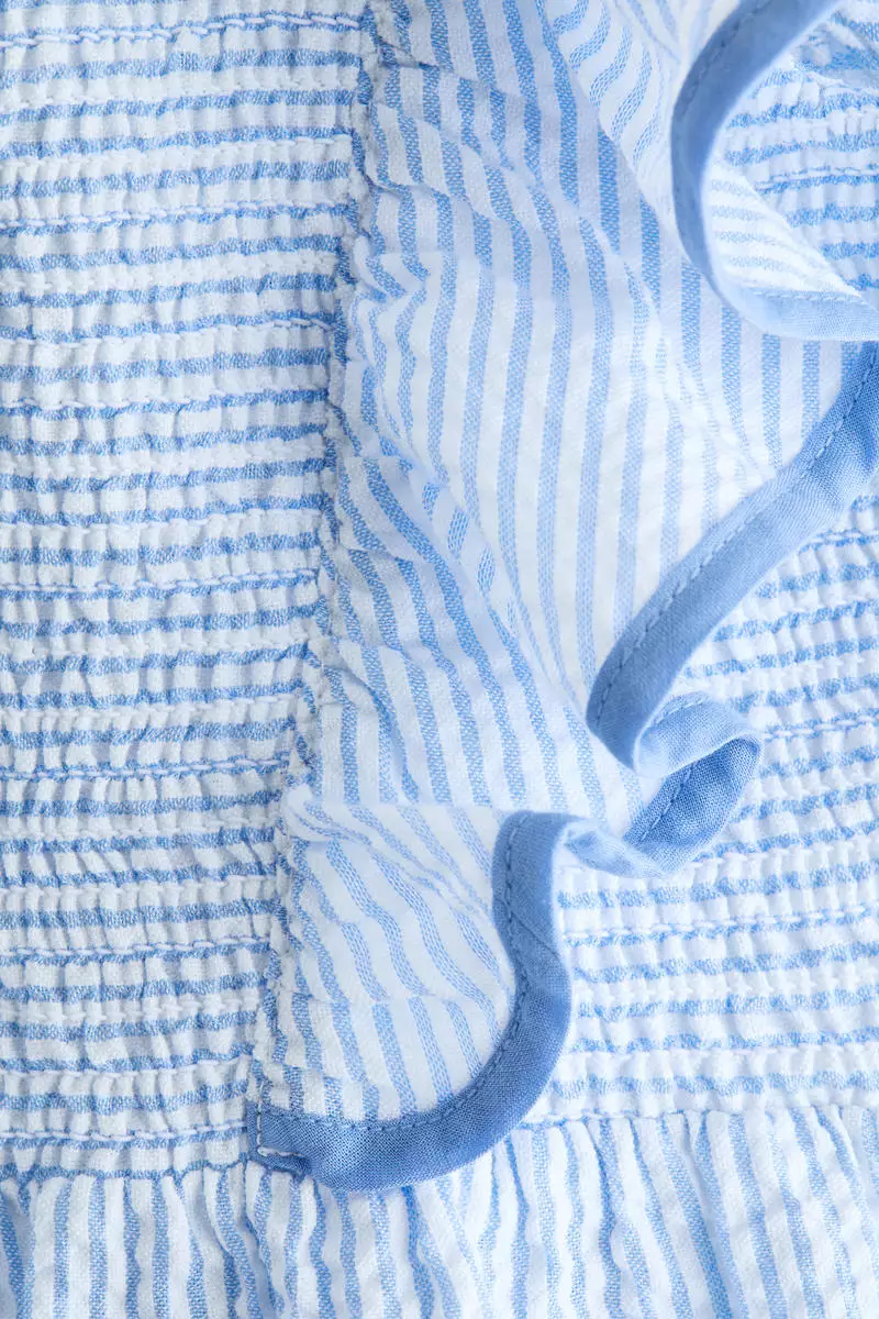 Smocked flounce-trimmed dress