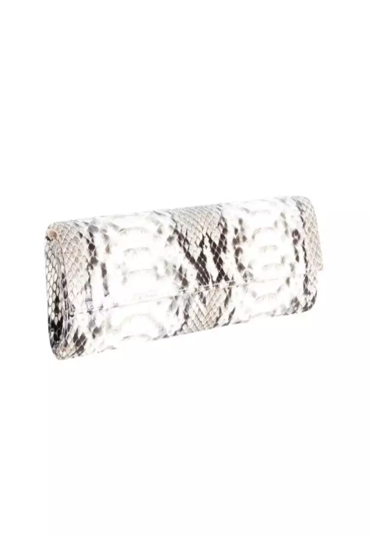 White store snakeskin clutch