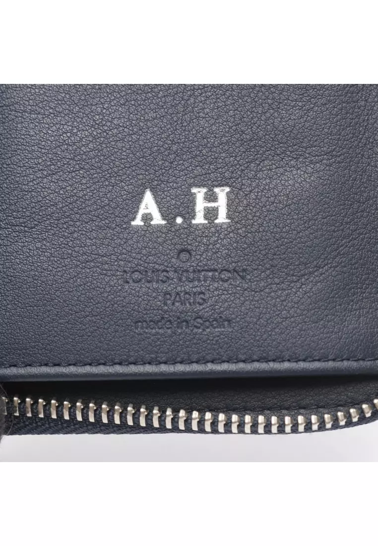 Pre-Loved Louis Vuitton zippy wallet Vertical round zipper long wallet taurillon leather Dark navy