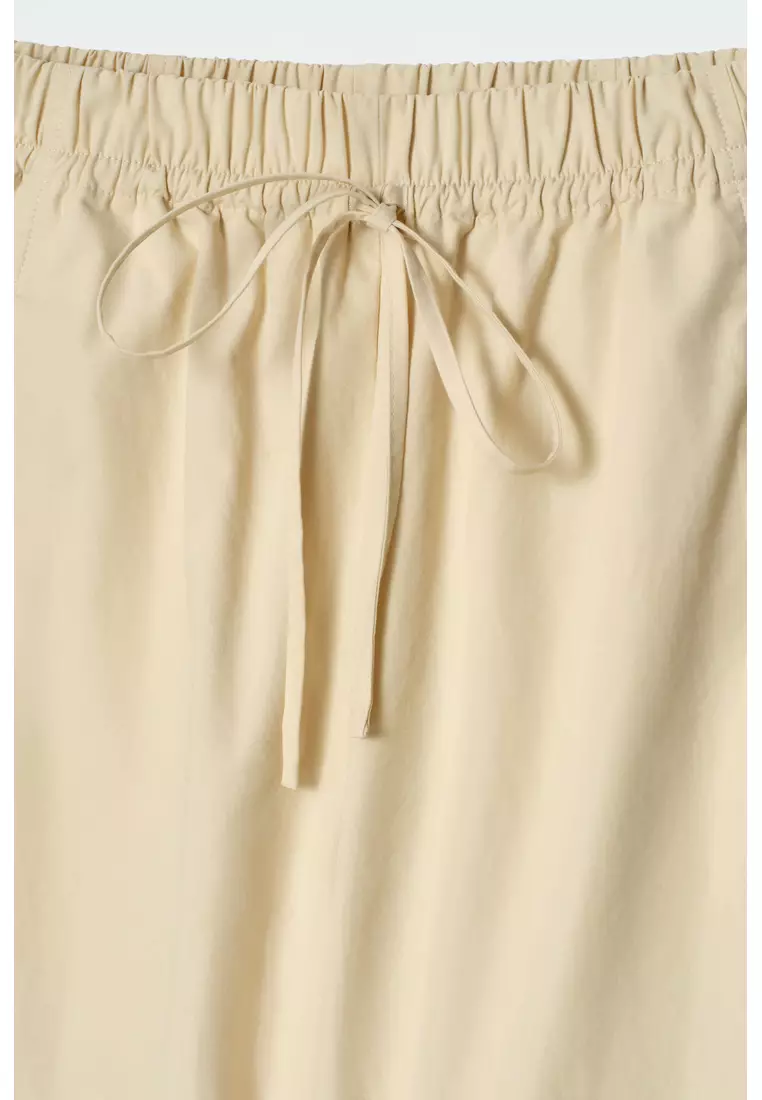 ELASTICATED BARREL-LEG TROUSERS