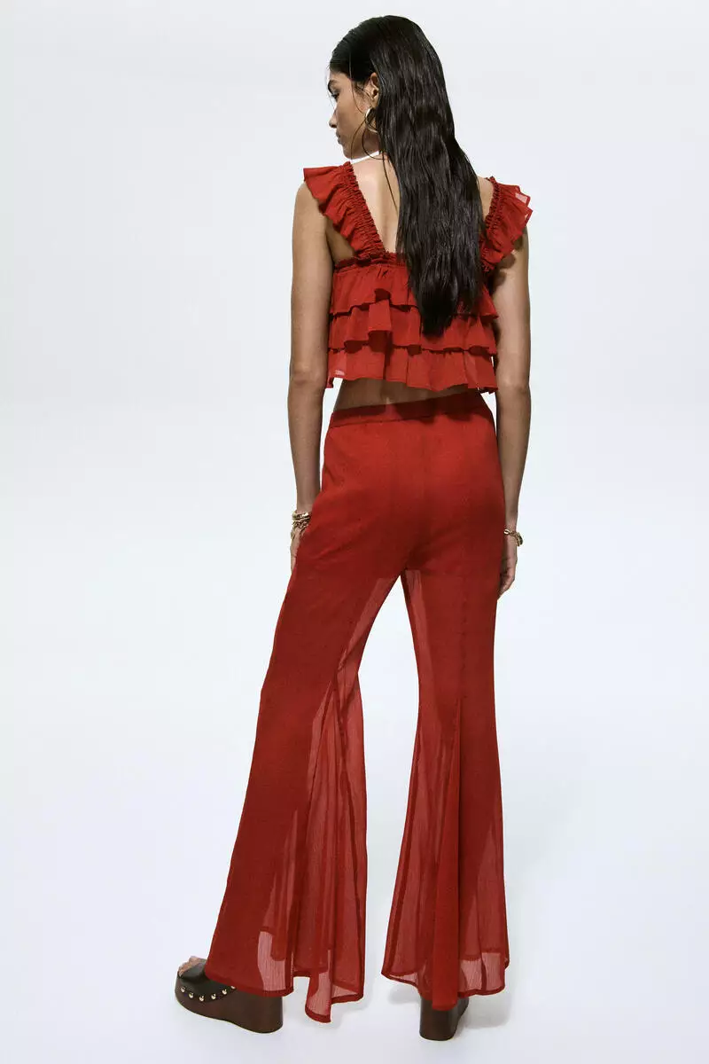 Flared crinkled trousers