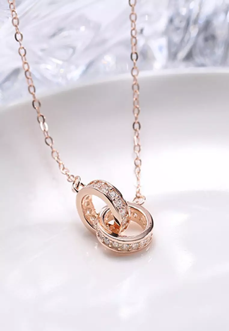 Gold chain with ring on sale pendant