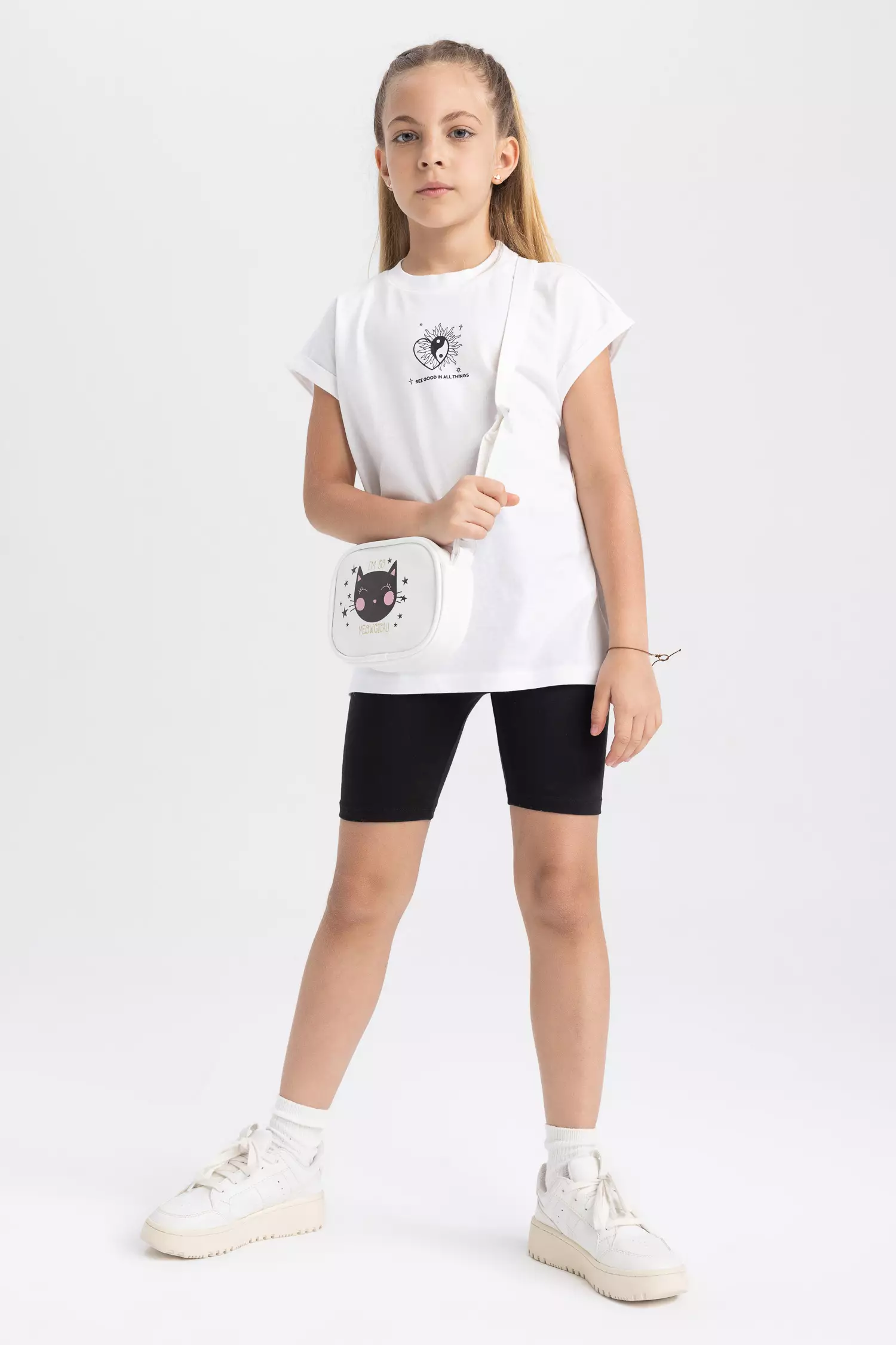 Girl in t shirt top and shorts