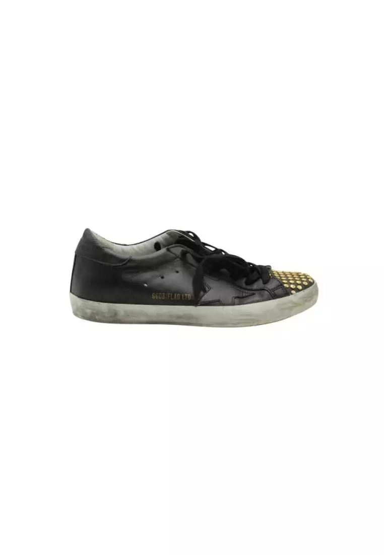 White sneakers with gold best sale studs
