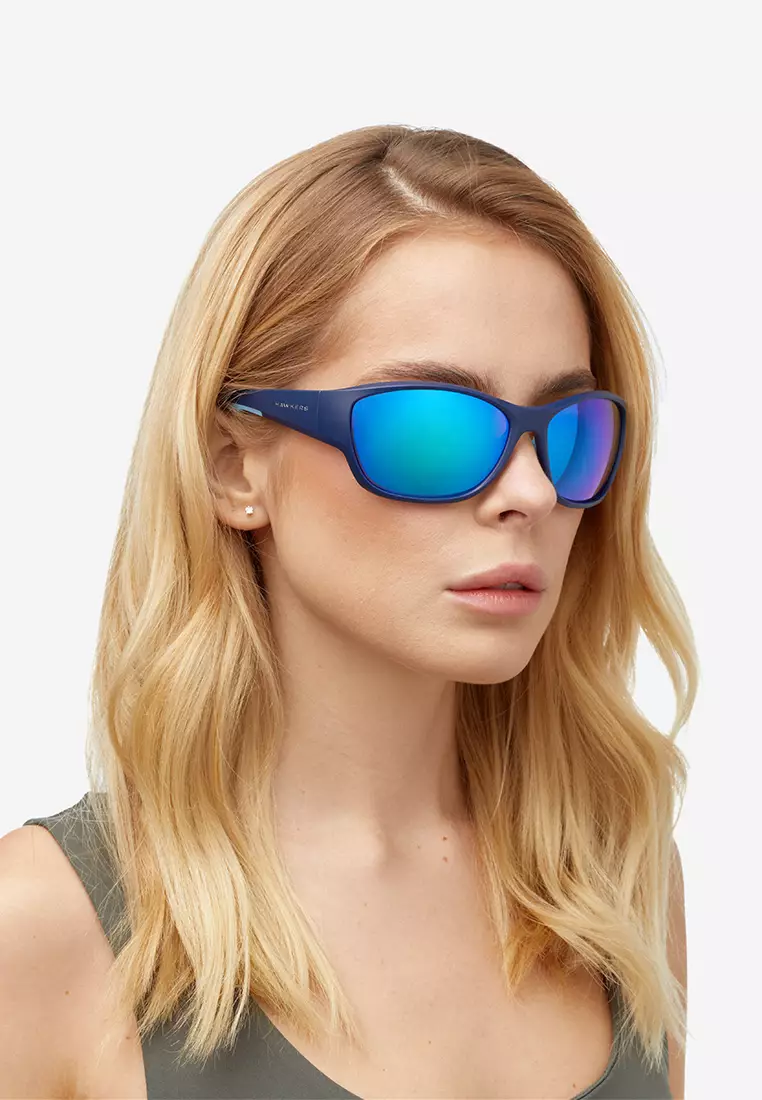 HAWKERS Navy Clear Blue RAVE Sunglasses for Men and Women, Unisex. UV400 Protection. Official Product designed in Spain