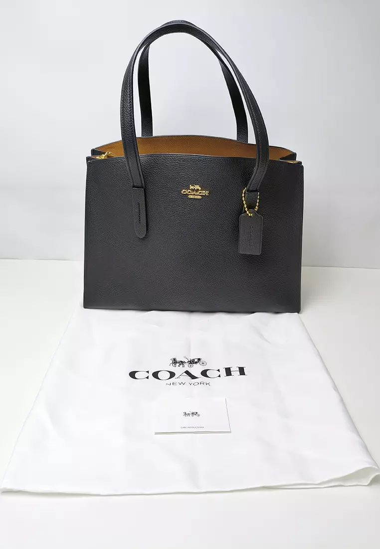 Coach charlie carryall black best sale
