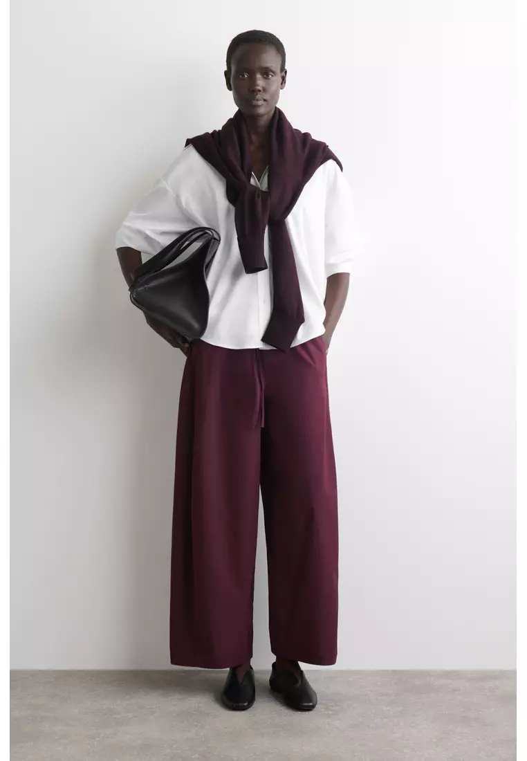 ELASTICATED BARREL-LEG TROUSERS