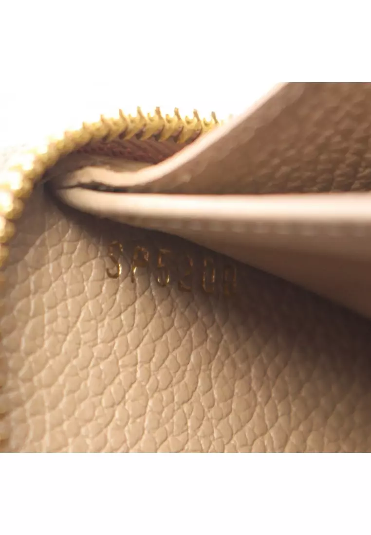 Pre-Loved Louis Vuitton zippy wallet bicolor monogram Empreinte tourterelle claim round zipper long wallet leather Gray beige ivory