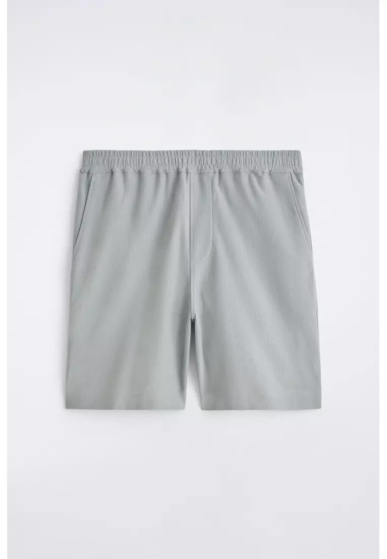 ELASTICATED COTTON-PIQUÉ SHORTS